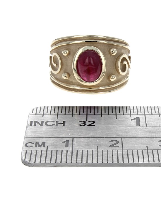 Ruby Cabochon Scroll Accent Ring in Yellow Gold